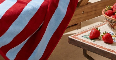 Colourful striped beach towel made from organic cotton.