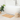 Wooden bath mat in front of a bathtub
