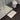 White stone bath mat made from a sustainable diatomite material.