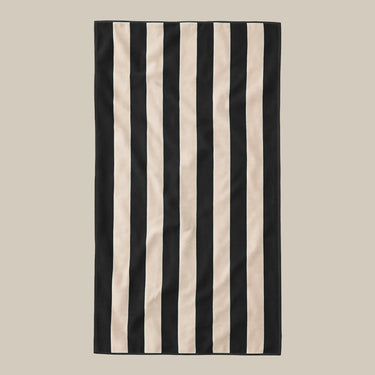Organic cotton black and cream striped beach towel in a large size for a premium feel.