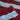 Close-up of maroon and light blue striped organic cotton beach towels.