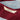 Maroon and blue striped beach towel made from organic cotton.