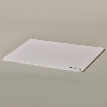 White bath mat made from stone which is a sustainable alternative to cotton bath mats.